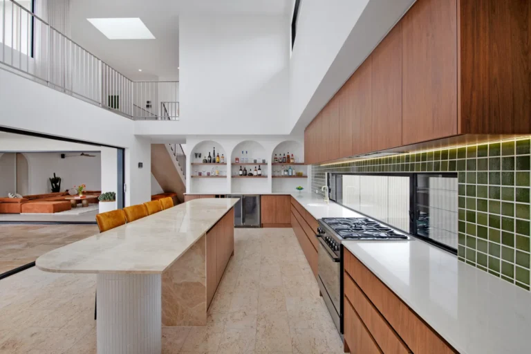Modern kitchen with island and open living space.