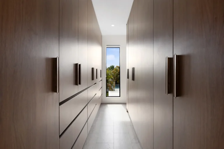 Modern walk-in closet with wooden cabinets