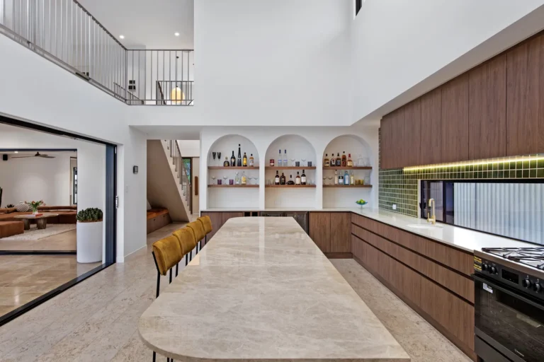 Modern open kitchen with marble island and shelves