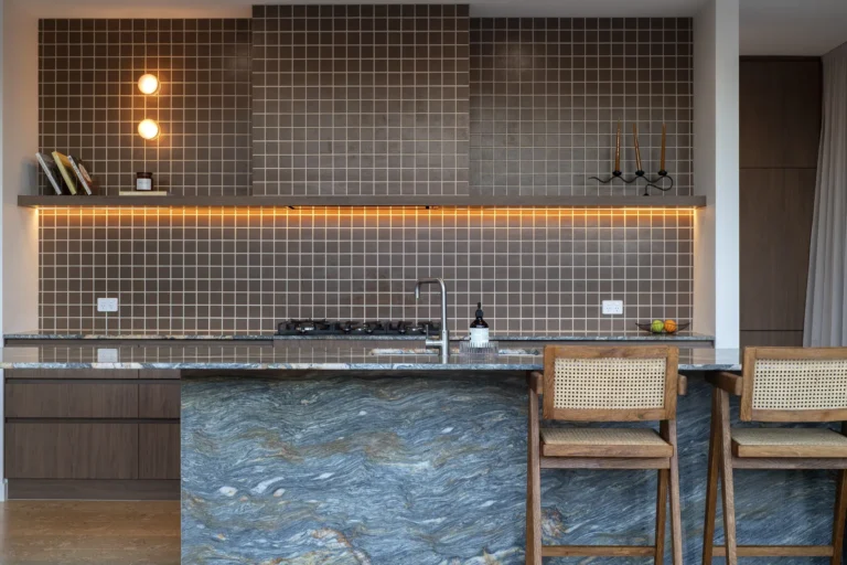 Modern kitchen with tile backsplash and blue countertop.