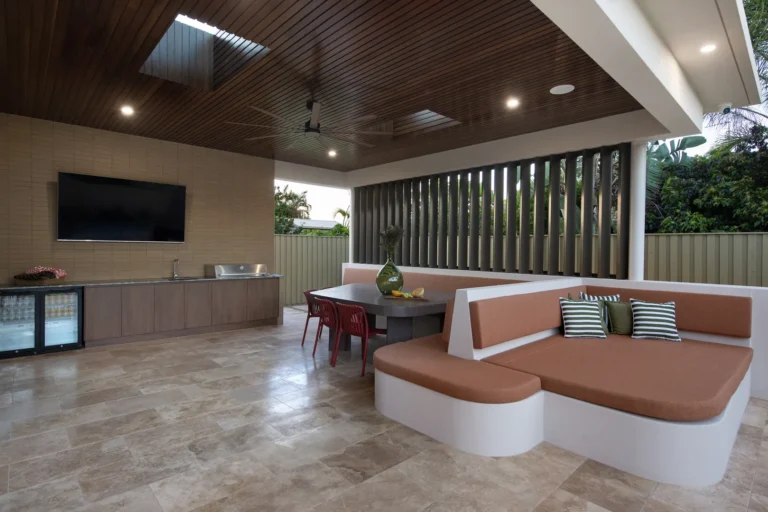 Modern outdoor patio with seating and TV