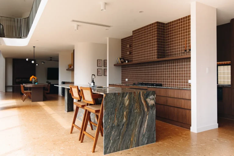 Modern kitchen with brown tiled backsplash
