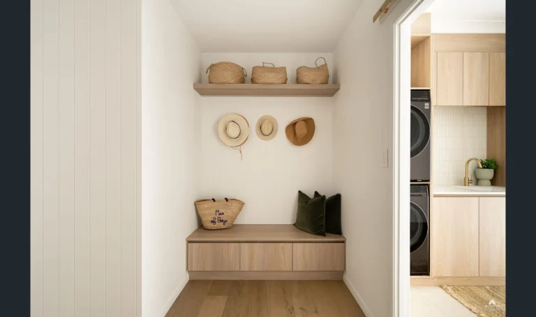 Minimalist mudroom with hats and wicker bags.